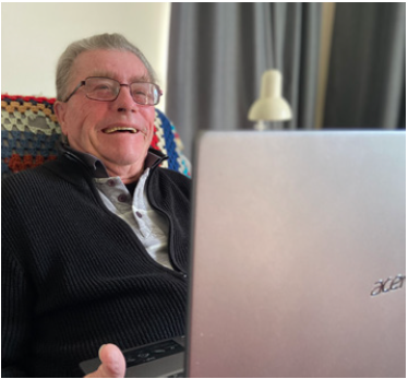 Ray Davey, seated behind a laptop